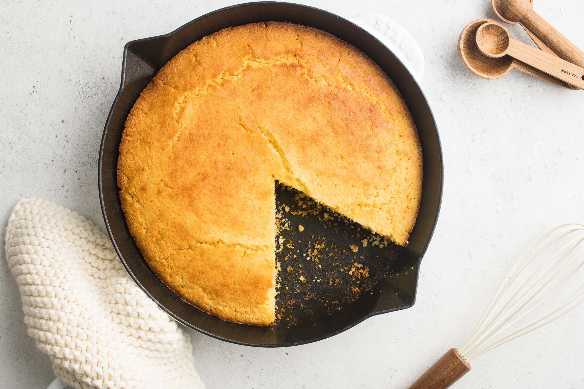 cornbread sliced in white skillet